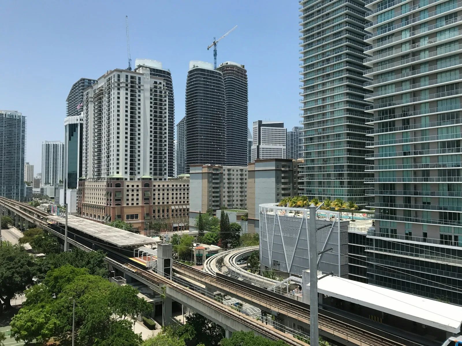 High-rise condominium towers and an elevated rail line in Miami's urban core