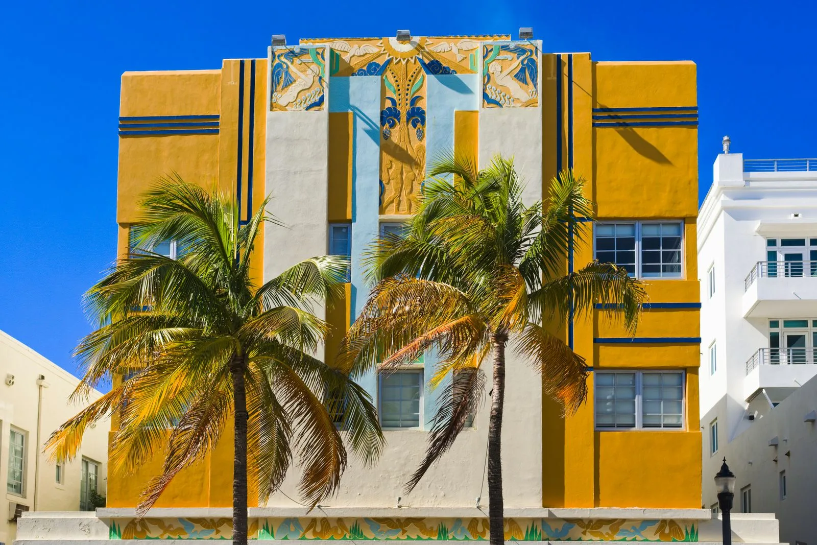 Art Deco building with palm trees in Miami Beach
