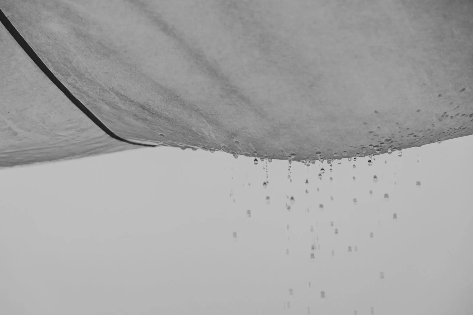 Water dripping from a sagging, water-damaged ceiling